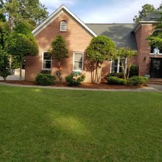 Well-maintained residential lawn and landscaping